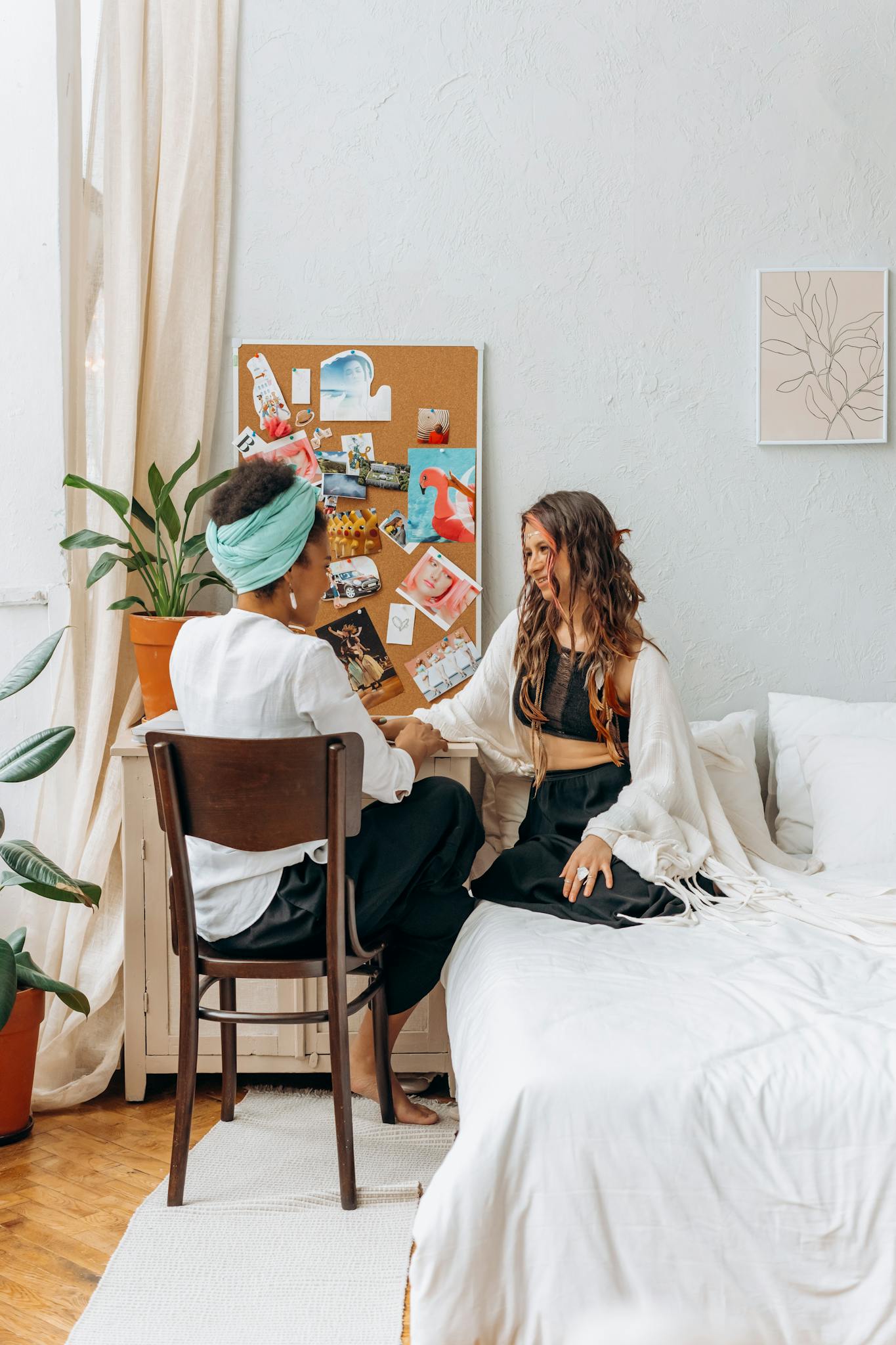 2 Women Sitting on Bed