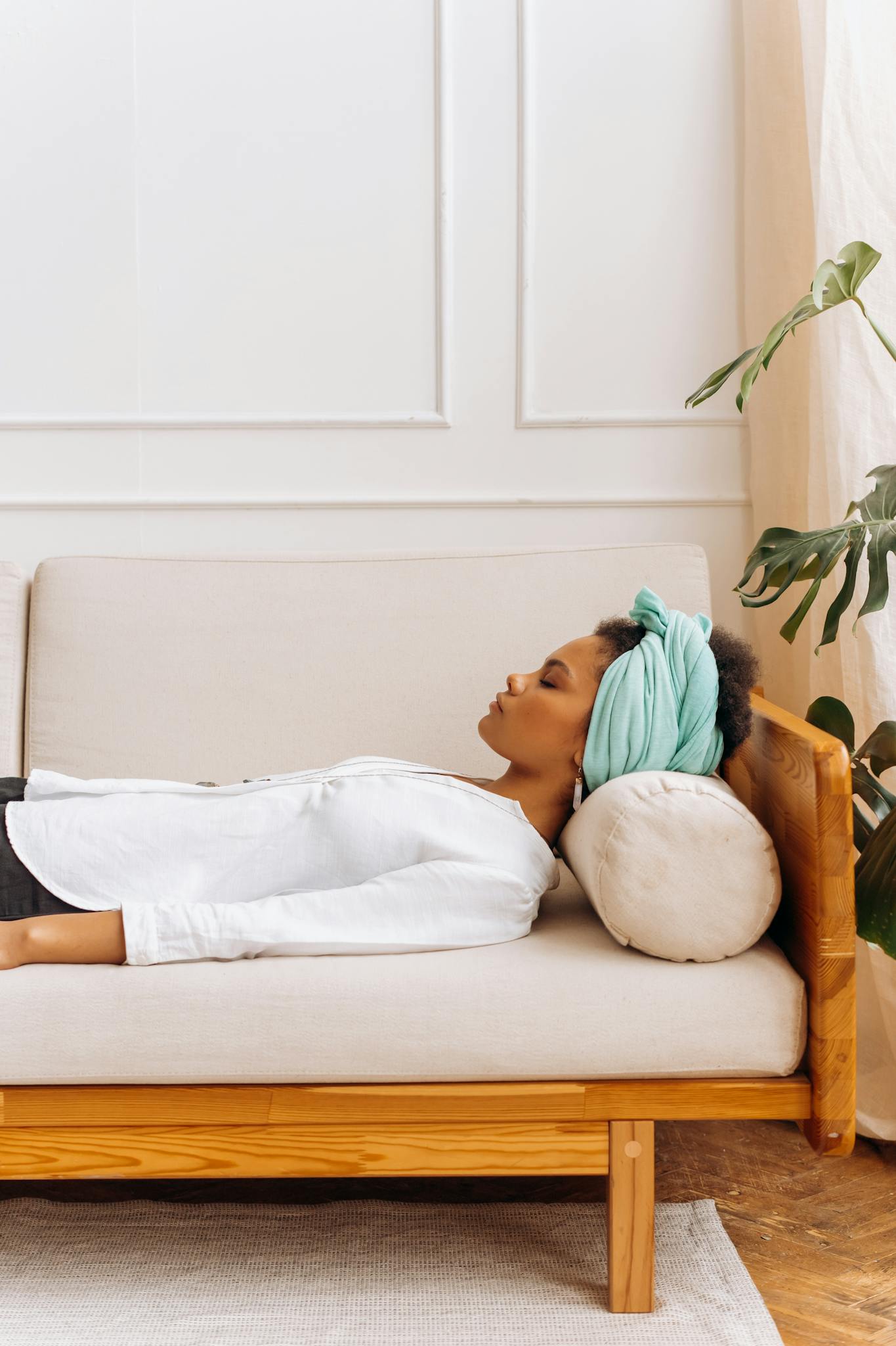 Woman in White Shirt Lying on Bed